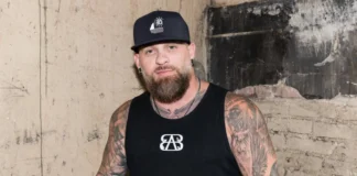 Brantley Gilbert performing live, representing his $10 million net worth from country music career.