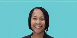 Neysa Fligor County Assessor — first Black female county assessor in California, standing in a Silicon Valley government office