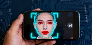 Person trying to identify deepfake video on phone with AI detection overlay on screen