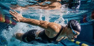 Olympic swimmer demonstrating why olympic swimmers breathe every 2 strokes during freestyle race