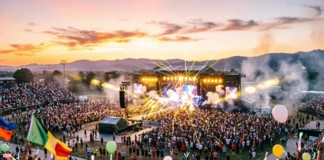 Massive crowd at one of the best concerts of all time with stage lights blazing