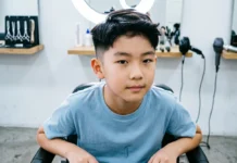 15+ Boys Fade Haircut Ideas and the Best Suave Kids Products for Easy Styling Boys fade haircut with clean low fade and neat sides at barber shop