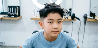Boys fade haircut with clean low fade and neat sides at barber shop