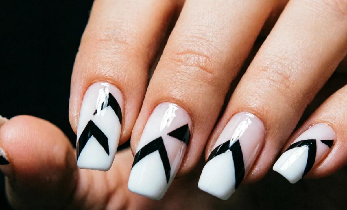 Coffin nails featuring detailed nail art design, showing the shape's versatility as a creative canvas.