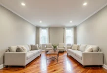 How Interior Design Home Resale Value Decisions Can Make or Break Your Sale Price Staged living room showing interior design home resale value with neutral walls, hardwood floors and layered lighting