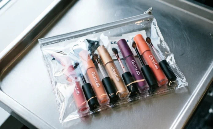 is-lip-gloss-a-liquid-tsa Lip gloss tubes in a TSA-approved quart bag, showing is lip gloss a liquid TSA rule in action