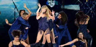 Taylor swift eras tour outfits: pink crystal bodysuit and blazer worn during the Lover era opening act.