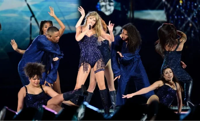 Taylor Swift Eras Tour Outfits: Lover Era Pink Crystal Bodysuit and Blazer on the Opening Stage Taylor swift eras tour outfits: pink crystal bodysuit and blazer worn during the Lover era opening act.